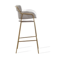 Hoher gepolsterter Hocker mit goldenen Beinen
